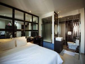 Postel nebo postele na pokoji v ubytování Hotel JUNE Haeundae