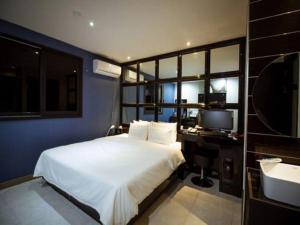 Postel nebo postele na pokoji v ubytování Hotel JUNE Haeundae