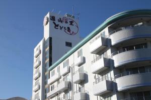 a building with graffiti on the side of it at Ikaho Onsen Todoroki in Shibukawa
