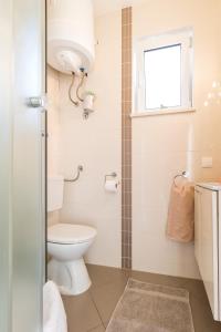 Kúpeľňa v ubytovaní Apartments Pina + 37 fotografií