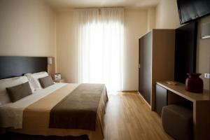 Llit o llits en una habitació de Hotel Miramare