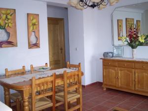 a dining room with a table and chairs at Casa Tere in Miller