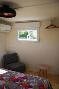 Ένα ή περισσότερα κρεβάτια σε δωμάτιο στο Péniche Mon'ro