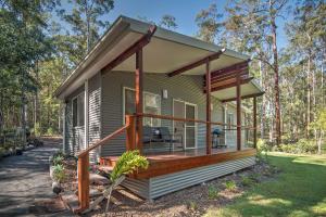 a tiny house with a wrap around deck at Oakey Creek Private Retreat in Gheerulla