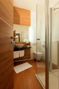 a bathroom with a sink and a toilet and a shower at Seminarhotel Lengbachhof GmbH in Altlengbach