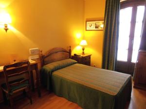 Postel nebo postele na pokoji v ubytování Hotel La Posada Regia