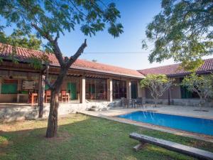 a house with a swimming pool in the yard at Yala Villa in Yala
