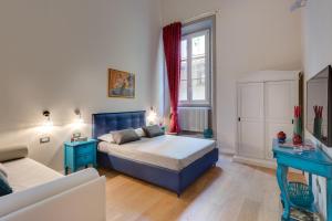 A bed or beds in a room at Residenza D'Epoca Historia Luxury Boutique