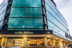 a building with a sign that reads the ole zen hotel at The Ole-Ken Hotel in Nakuru