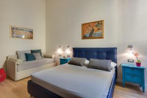 A bed or beds in a room at Residenza D'Epoca Historia Luxury Boutique