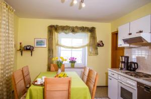 a kitchen with a table with bananas on it at Ferienwohnung "Gaby" in Freyung