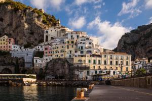 a large white building on top of a mountain at Vista d'Amalfi in Amalfi