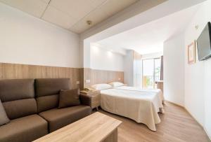 Postel nebo postele na pokoji v ubytování Hotel Montemar