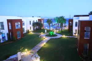 an aerial view of a yard with buildings at Costa Luvi Hotel Bodrum - All Inclusive in Gümbet