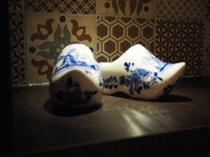 a pair of blue and white shoes sitting on a table at Blossoms City Hotel in Amsterdam