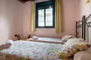 Кровать или кровати в номере Casa Rural EL CANAL 2LM