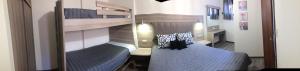 two beds in a room with two bunk beds at Palmyra Studios in Stavros