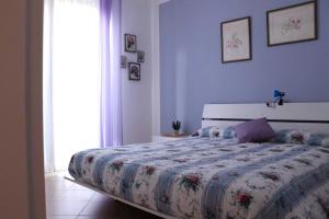 Postel nebo postele na pokoji v ubytování Orchidea apartments
