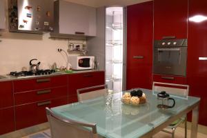 Kuchyň nebo kuchyňský kout v ubytování Orchidea apartments