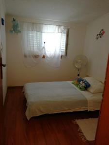 Katil atau katil-katil dalam bilik di Apartments Mira
