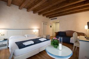 Uma cama ou camas num quarto em Albergo Mazzanti
