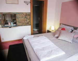 Posteľ alebo postele v izbe v ubytovaní Garda Residence