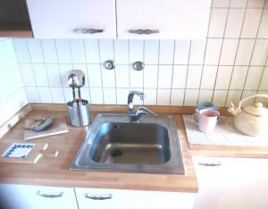 Kuchyňa alebo kuchynka v ubytovaní Garda Residence + 3 fotografie
