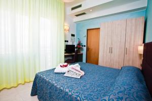 Postel nebo postele na pokoji v ubytování Hotel Levante