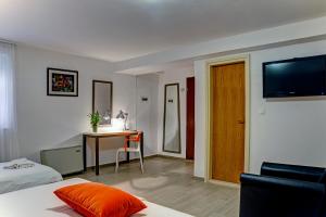 Postel nebo postele na pokoji v ubytování Hotel Skradinski Buk