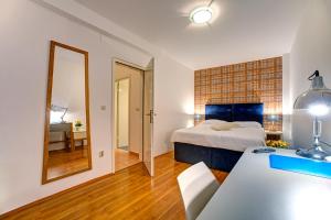 Postel nebo postele na pokoji v ubytování Hotel Skradinski Buk