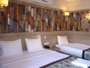 Postel nebo postele na pokoji v ubytování Street61 Apart Hotel