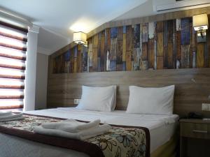 Postel nebo postele na pokoji v ubytování Street61 Apart Hotel