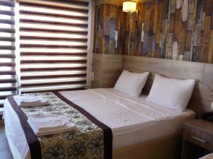 Postel nebo postele na pokoji v ubytování Street61 Apart Hotel