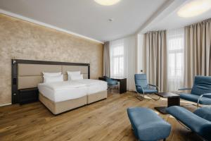 Postel nebo postele na pokoji v ubytování Theresian Hotel