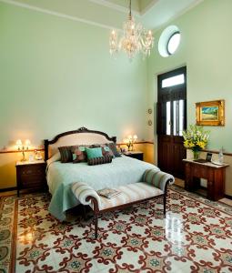 מיטה או מיטות בחדר ב-Casa Azul Monumento Historico