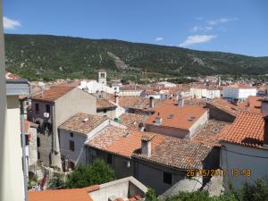 a view of a town with red tile roofs at Apartment Goga in Cres