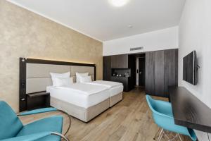 Postel nebo postele na pokoji v ubytování Theresian Hotel