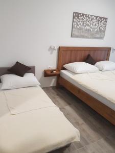 מיטה או מיטות בחדר ב-Guesthouse Galimar