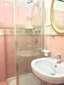 a bathroom with a sink and a shower at Villa Cenzina in Selva di Fasano