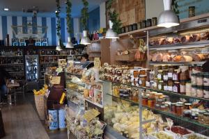 a grocery store filled with lots of food at Casa Lame in Bologna