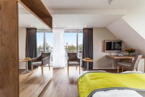 TV a/nebo společenská místnost v ubytování Hotel Restaurant Hansjakob