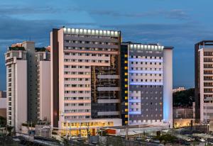 a group of tall buildings in a city at ibis budget Jundiai Shopping in Jundiaí