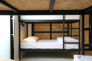 Voodi või voodid majutusasutuse Sleeping Well Chiangkhong toas
