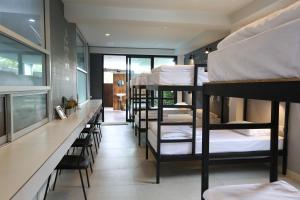 Voodi või voodid majutusasutuse Sleeping Well Chiangkhong toas