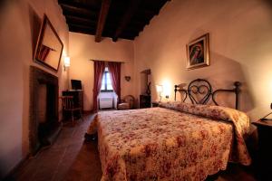 Ένα ή περισσότερα κρεβάτια σε δωμάτιο στο Palazzo Orsini