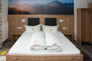 Letto o letti in una camera di Haus Moosbrugger