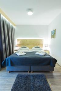 
Łóżko lub łóżka w pokoju w obiekcie Willa Baciarka
