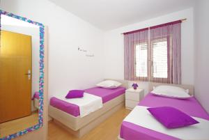 Postel nebo postele na pokoji v ubytování Apartments Senka