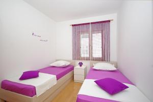 Postel nebo postele na pokoji v ubytování Apartments Senka