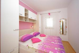 Postel nebo postele na pokoji v ubytování Apartments Senka